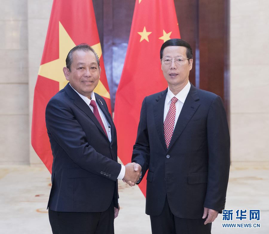  9月11日，中共中央政治局常委、國務院副總理張高麗在廣西南寧會見前來出席第十四屆中國－東盟博覽會和中國－東盟商務與投資峰會的越南常務副總理張和平。新華社記者王曄攝